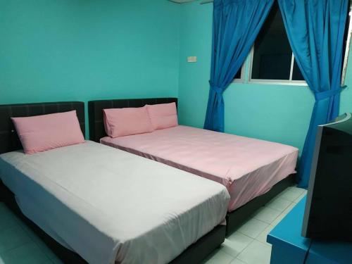 מיטה או מיטות בחדר ב-Formosa Hotel