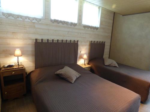 מיטה או מיטות בחדר ב-La Fontainoise