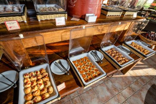 a display of trays of pastries in a bakery at Patachocas in Morro de São Paulo