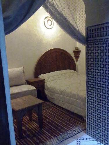 Riad Benchekrounにあるベッド