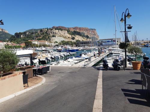 a couple of motorcycles parked next to a marina at Mini Loft in Cassis