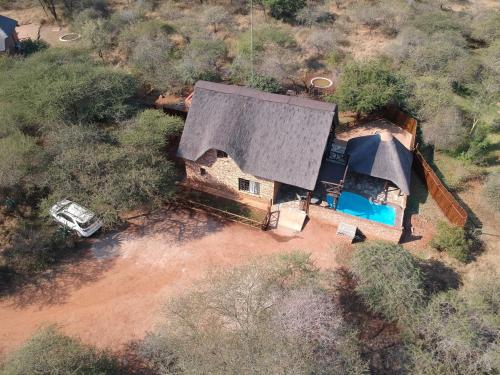 an overhead view of a house with a swimming pool at Giraffe plains in Marloth Park