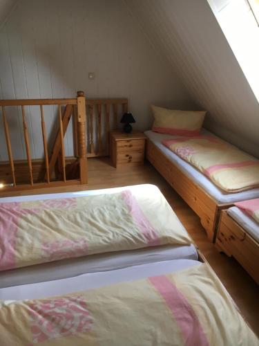 Postel nebo postele na pokoji v ubytování Ferienhaus Burwitz auf Rügen