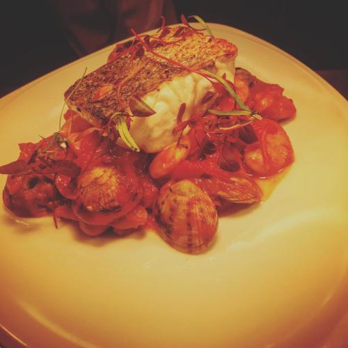 a plate of food with meat and vegetables on it at The Devonshire Grassington in Grassington