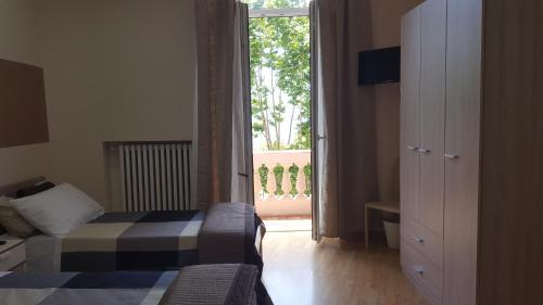 Letto o letti in una camera di Accommodation Feel Salerno
