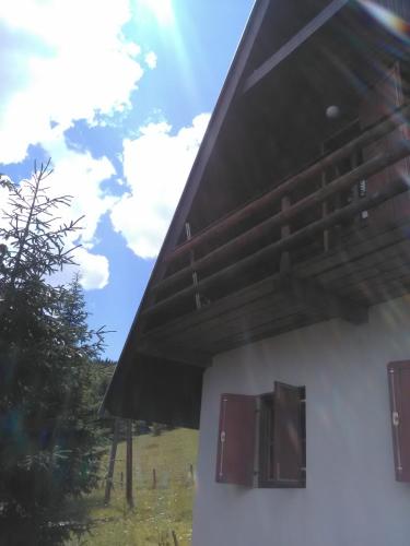 a building with awning on the side of it at Holiday Home Ema in Plešin