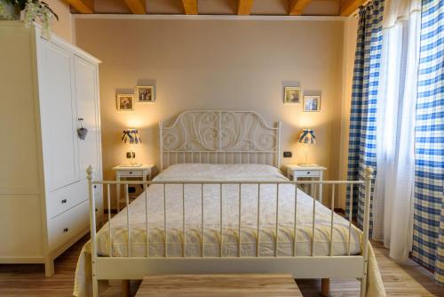 Postel nebo postele na pokoji v ubytování Ca' Dei Coci B&B