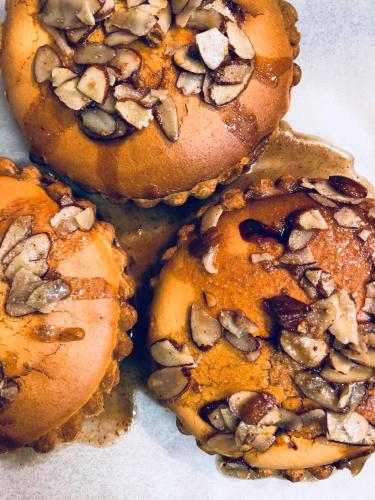 a group of cookies with nuts on top of them at Edit Picton in Picton