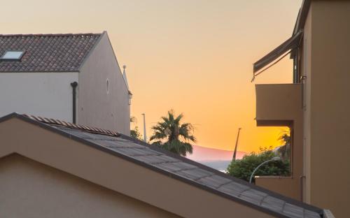 a view of the sunset from the roof of a building at Acqua Azzurra in Alghero