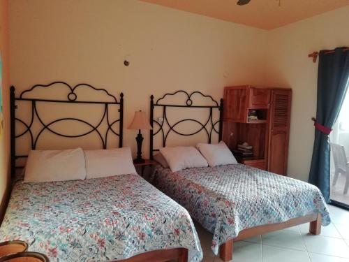 Cama ou camas em um quarto em Castillito Kin Nah