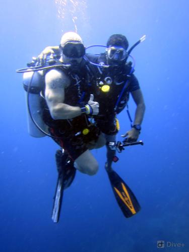 two people in the water in a diver suit at Shamar Guesthouse & Dive in Maamigili