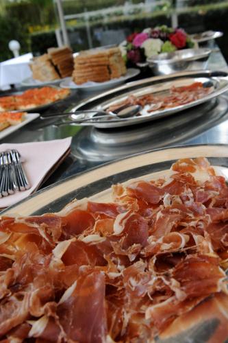a table with plates of food on it at Hotel Geerts in Westerlo
