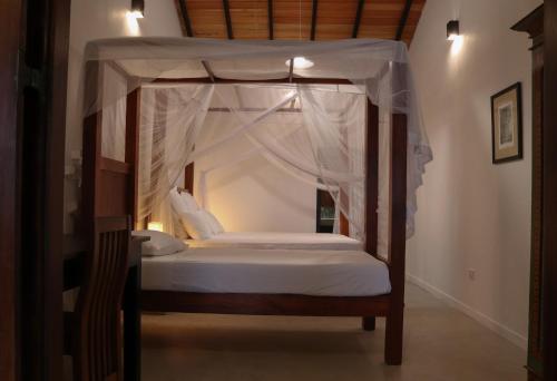 Voodi või voodid majutusasutuse Blue Parrot Beach Villa toas