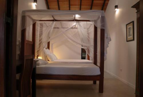 Ένα ή περισσότερα κρεβάτια σε δωμάτιο στο Blue Parrot Beach Villa
