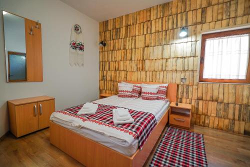 Postel nebo postele na pokoji v ubytování Casa Ralucăi