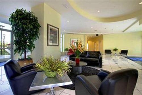 a living room with a couch and a table at University Plaza Waterfront Hotel in Stockton
