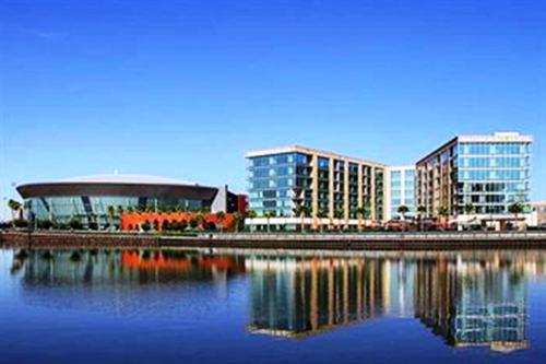 a city with tall buildings and a body of water at University Plaza Waterfront Hotel in Stockton