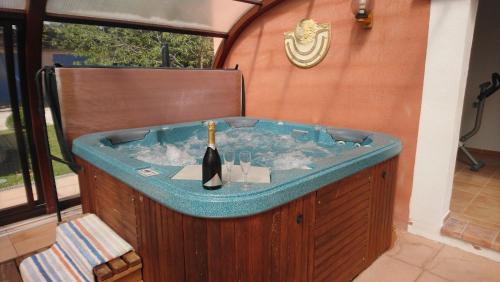 a jacuzzi tub in a room with at Chambre et table d'hôtes Villa Pomponette in Nans-les-Pins