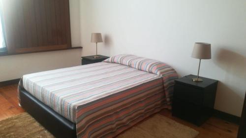 מיטה או מיטות בחדר ב-Casa da Malta- Só para famílias