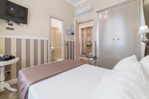 Letto o letti in una camera di Le Chiavi di Roma