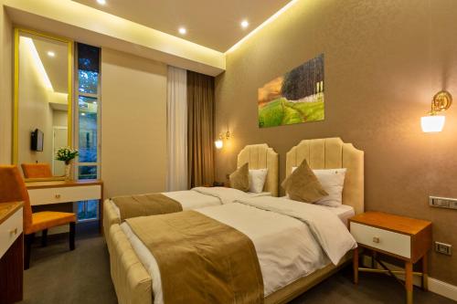 Tempat tidur dalam kamar di Aksent Hotel