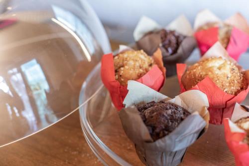 a group of chocolate muffins in a glass container at ibis Styles Lausanne Center MadHouse in Lausanne
