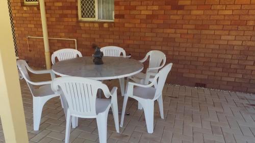 a white table and chairs on a patio at The Garden House in Tamworth