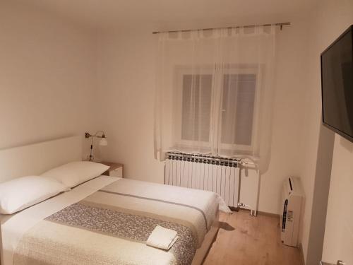Posteľ alebo postele v izbe v ubytovaní Apartman Bura