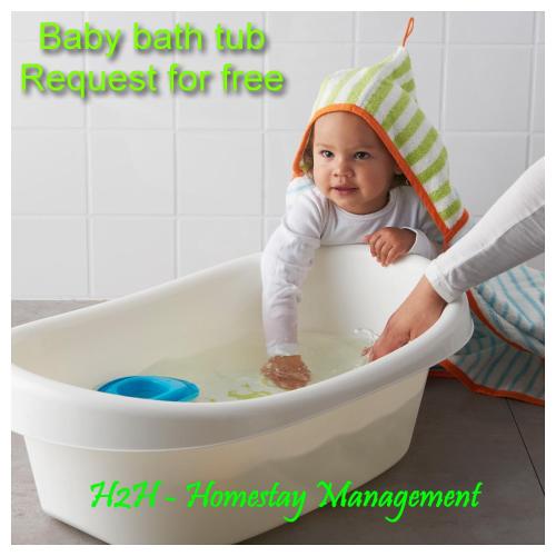 a baby sitting in a bath tub with a hat at H2H - Reunion House @ Majestic Ipoh 家好月圆 in Ipoh
