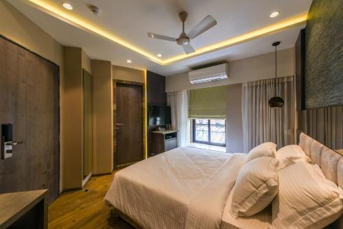 Voodi või voodid majutusasutuse Hotel Orient Regency toas