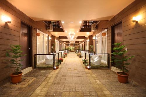 a hallway with a row of urinals in a building at Sinon Baga Retreat in Baga
