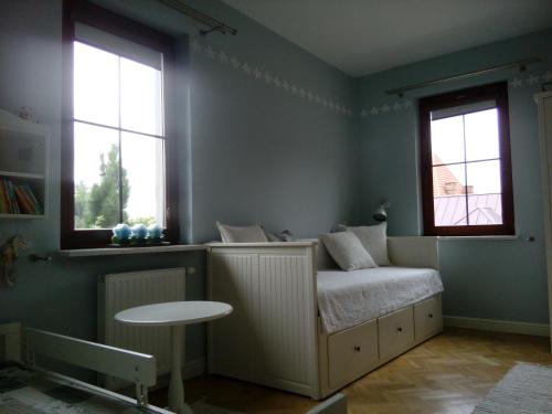 Ένα ή περισσότερα κρεβάτια σε δωμάτιο στο Apartament Rodzinny