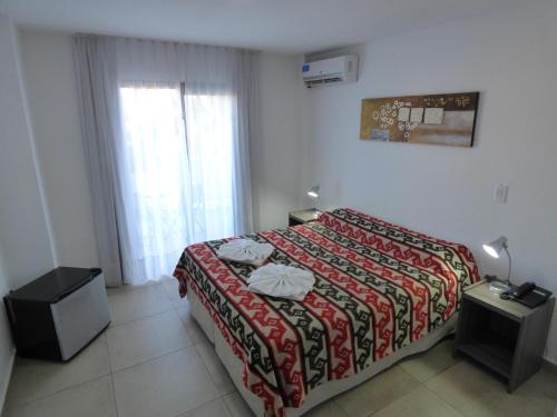 Una cama o camas en una habitación de Hotel Pinar del Lago