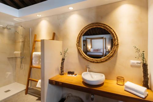 a bathroom with a sink and a mirror at Hotel Boutique Palacio Ico - Adults Recommended in Teguise