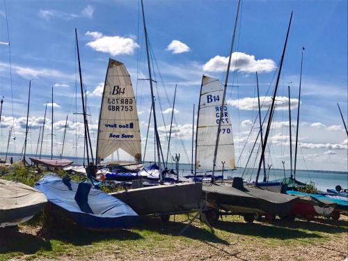 a group of sailboats parked on the beach at Beach Retreat in Whitstable