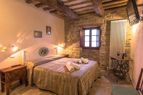 Postel nebo postele na pokoji v ubytování Valbuona b&b