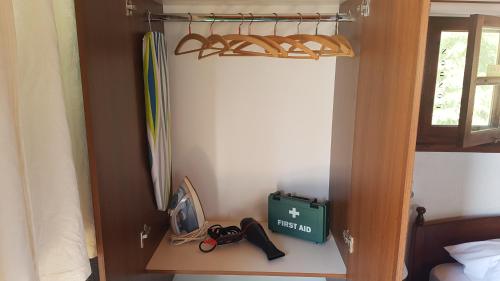 a room with a bed and a shelf with a surfboard at ZORBAS Sea View No 4 in Larnaka