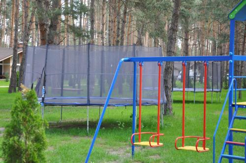 a playground with a blue and red swing at Park-Hotel Tihiy Les in Prokhorovka