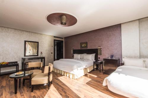 Postel nebo postele na pokoji v ubytování Hotel Almas
