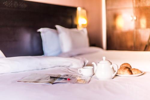 Postel nebo postele na pokoji v ubytování Hotel Almas