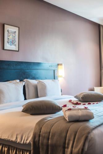 Postel nebo postele na pokoji v ubytování Hotel Almas