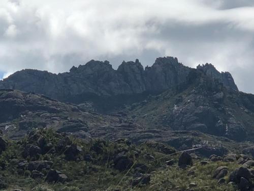 a view of a mountain range with rocks and trees at Estalagem Engenho de Serra - Parque Nacional do Itatiaia - Parte Alta in Itamonte