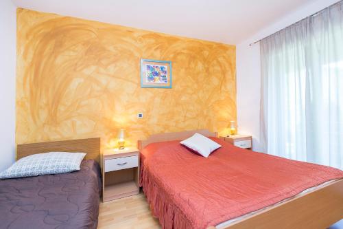 Postel nebo postele na pokoji v ubytování Apartment Ana