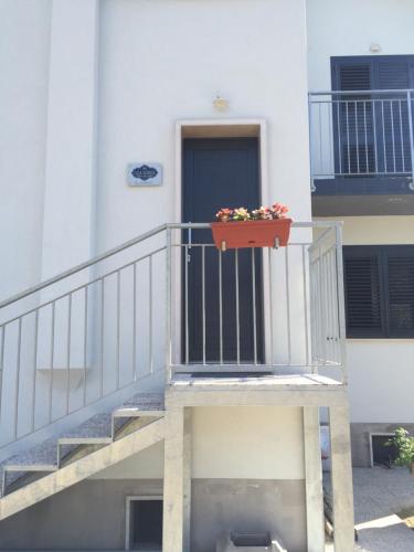 a flower pot on the balcony of a building at B&B Casa Giorgia in Campobasso