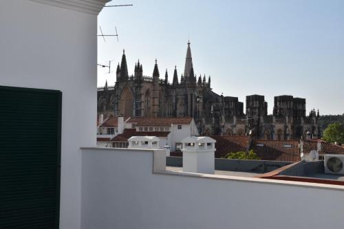 a view of a city from the roof of a building at Varandas do Mosteiro in Batalha