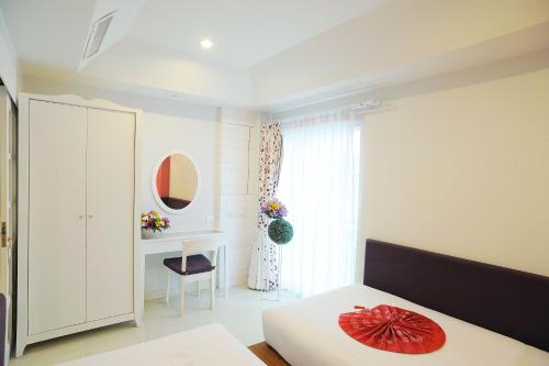 Кровать или кровати в номере The Beach Boutique House