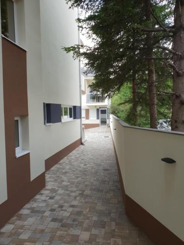 an empty hallway of a building with trees at Konak Kutko in Pančevo