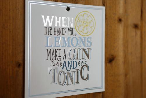 a framed picture of a sign on a wooden wall at Villa Maxime in Ostend
