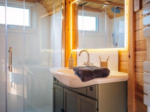 a bathroom with a sink and a shower at Hex at Hollands Farmhouse in Dorchester
