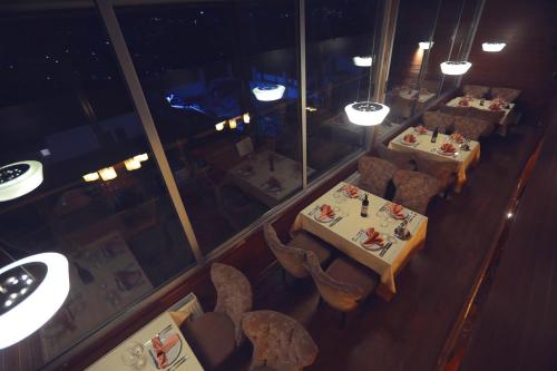 an overhead view of a restaurant with tables and chairs at Hotel Pinocchio in Pristina